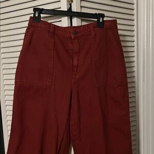Universal Thread Burnt orange or crimson colored wide leg barrel type jeans.